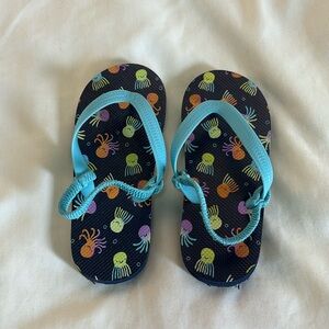 Kids size 11 / 12 size large cat and jack flip flops